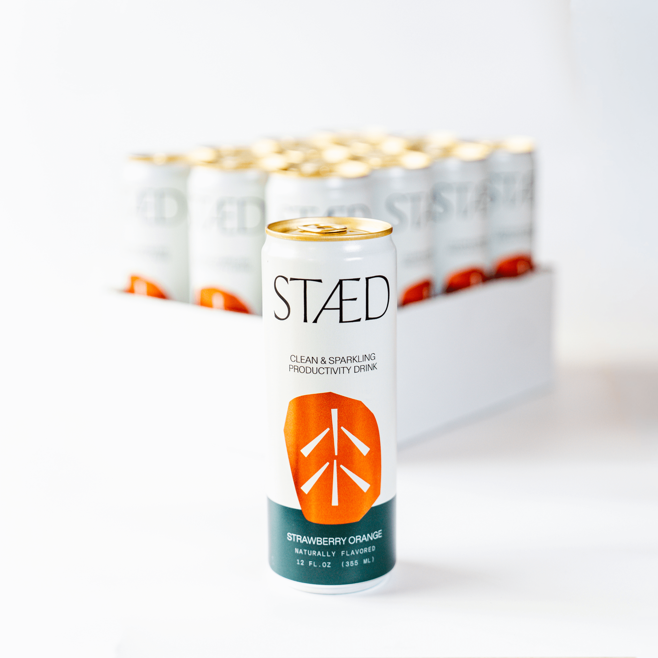 STAÜd energy drink can with packaging in the background