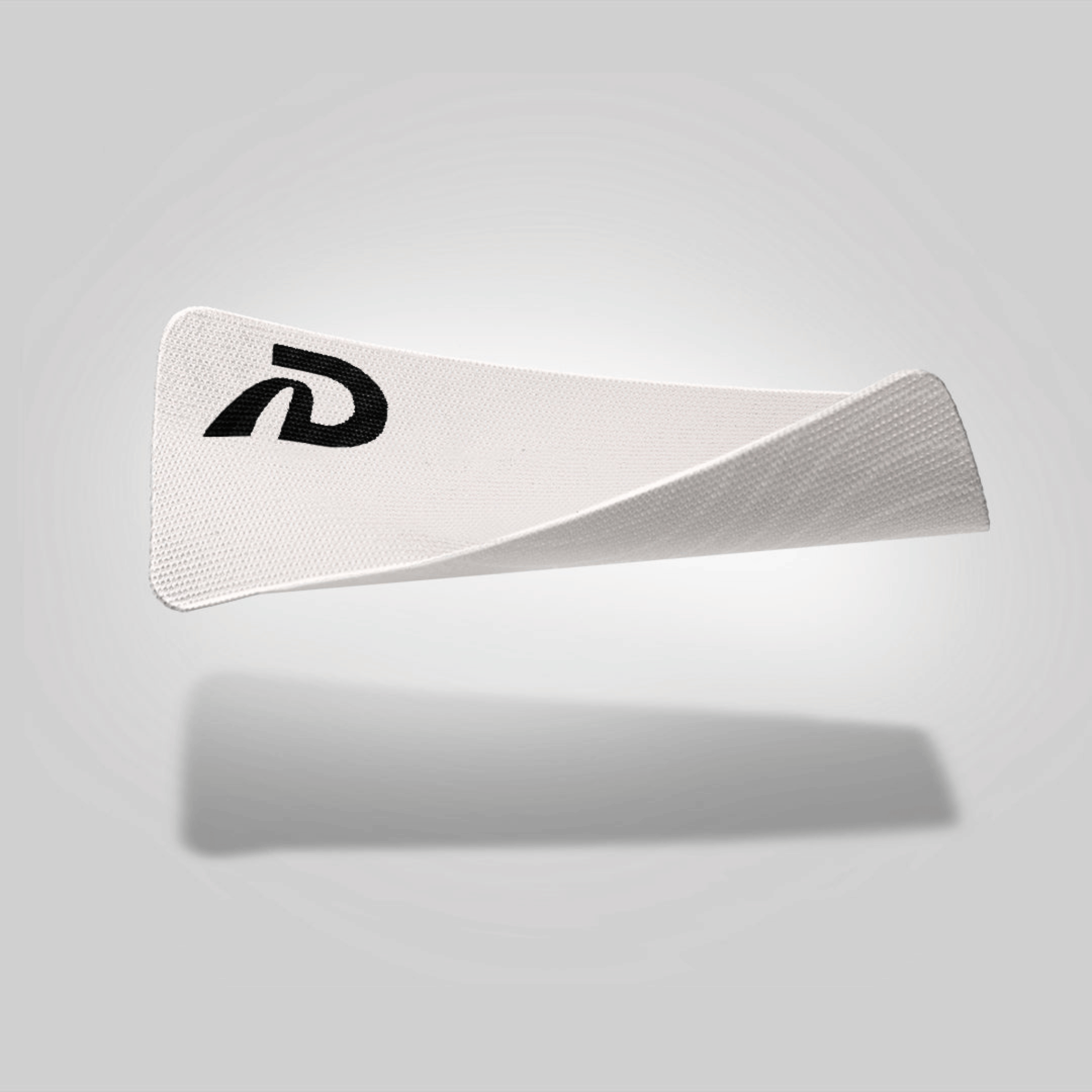 A piece of white mouth tape with a black logo on the upper left corner, presented against a grey background.